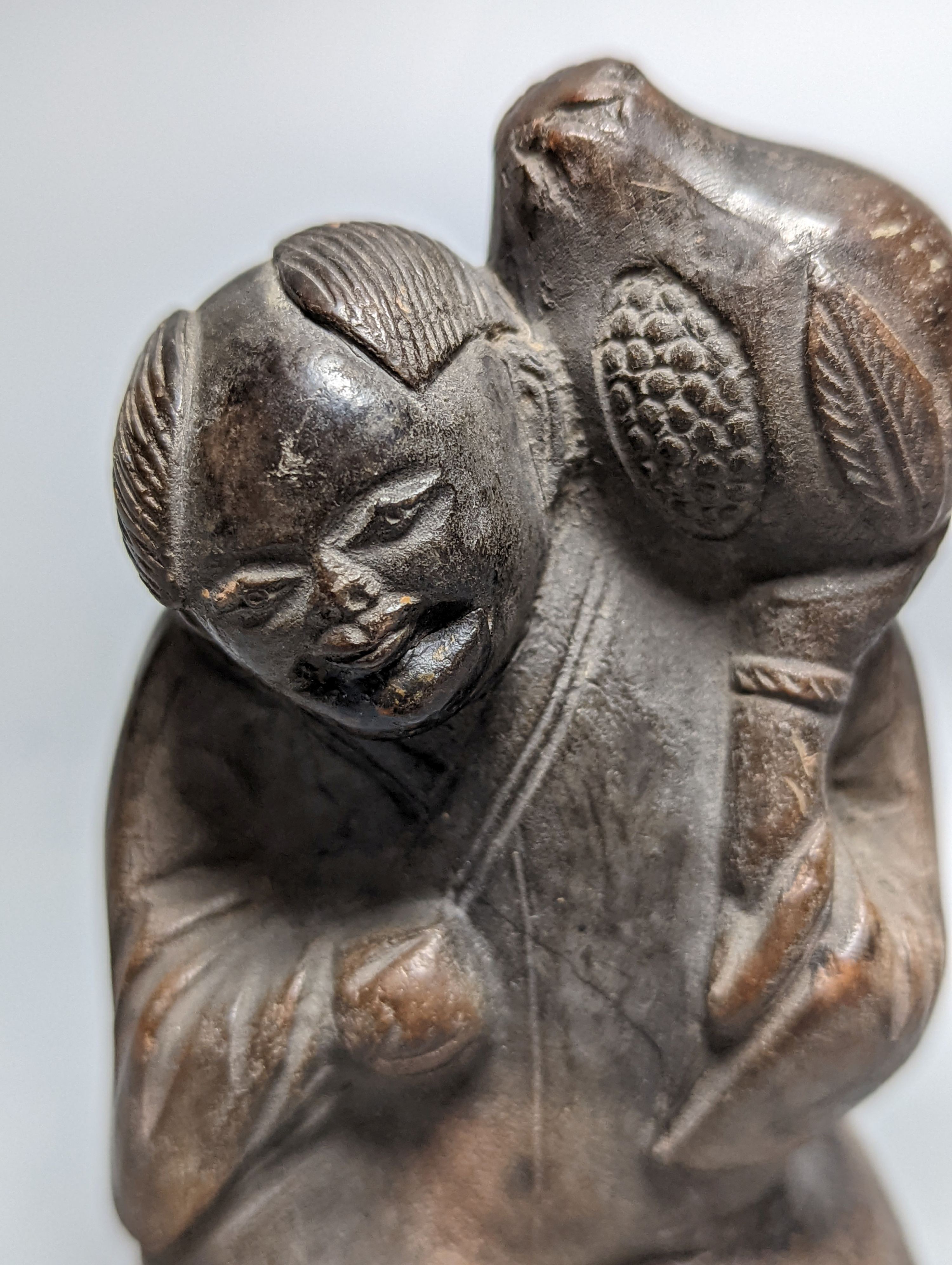 A late 19th/early 20th century Chinese pottery figure, 9.5cm impressed maker’s mark